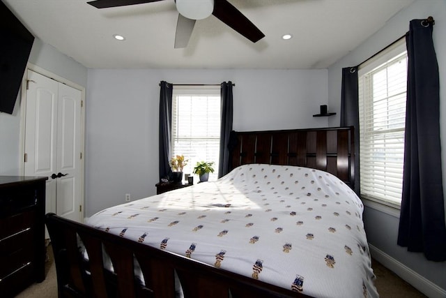 bedroom with multiple windows, a closet, and ceiling fan