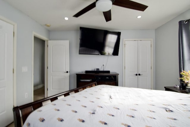 bedroom featuring ceiling fan and a closet