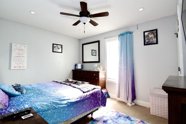 carpeted bedroom featuring ceiling fan