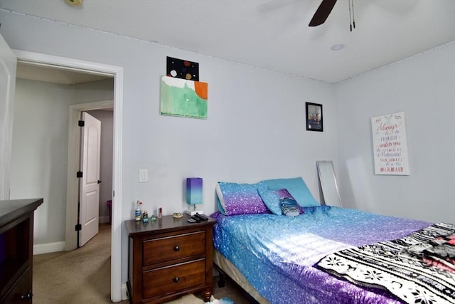 bedroom with ceiling fan and carpet floors