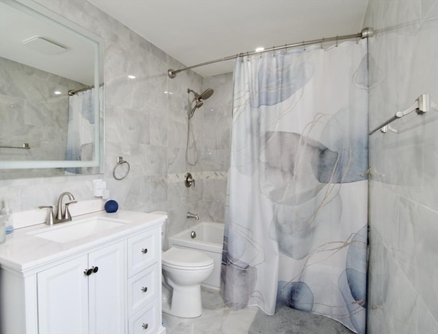 full bathroom with vanity, toilet, tile walls, and shower / bath combo with shower curtain