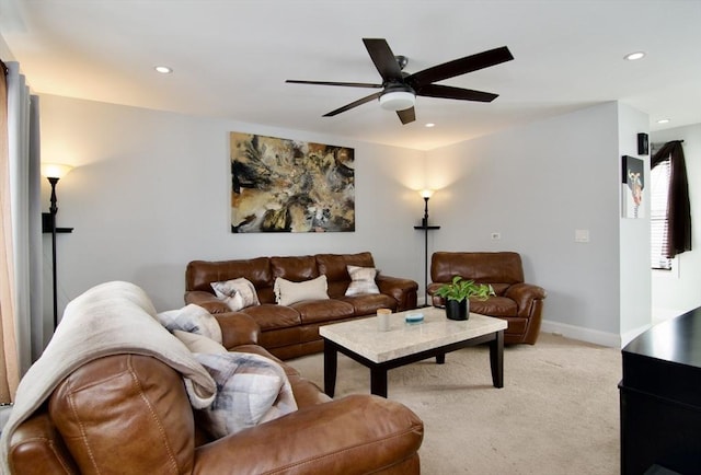 carpeted living room featuring ceiling fan