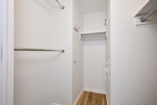 580 Washington St Unit 10F, Boston, MA 02111 - spacious closet with wood finished floors