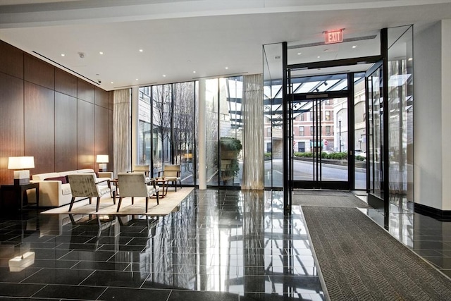 580 Washington St Unit 10F, Boston, MA 02111 - common area with floor to ceiling windows, a high ceiling, and wooden walls