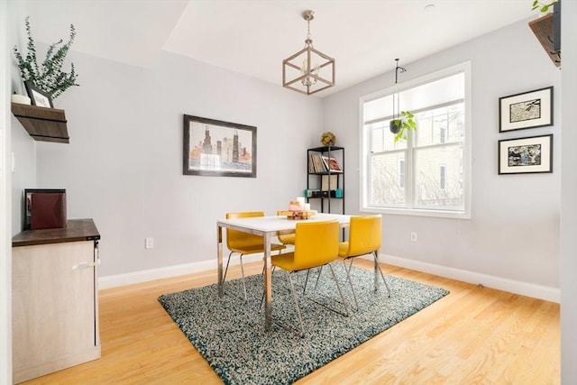 dining area with hardwood / wood-style floors