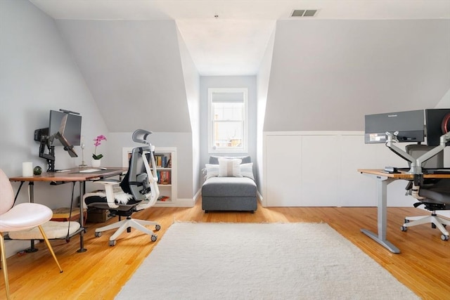 office space with wood-type flooring