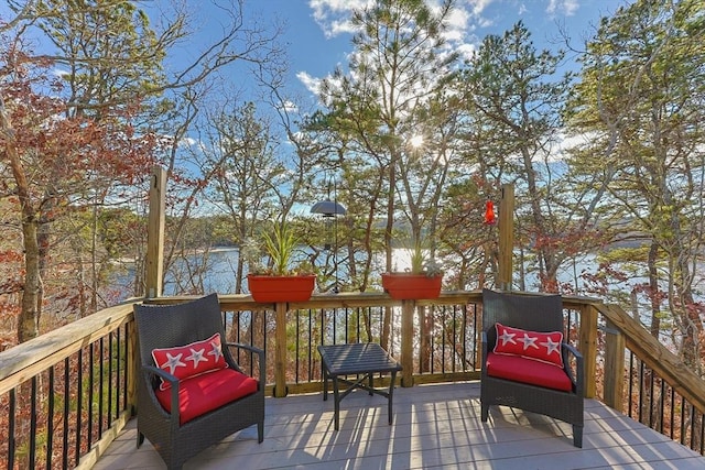 wooden deck featuring a water view