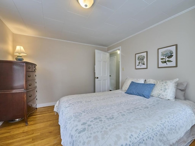 440 Forest St, Waltham, MA 02452 - bedroom featuring light wood finished floors, crown molding, and baseboards