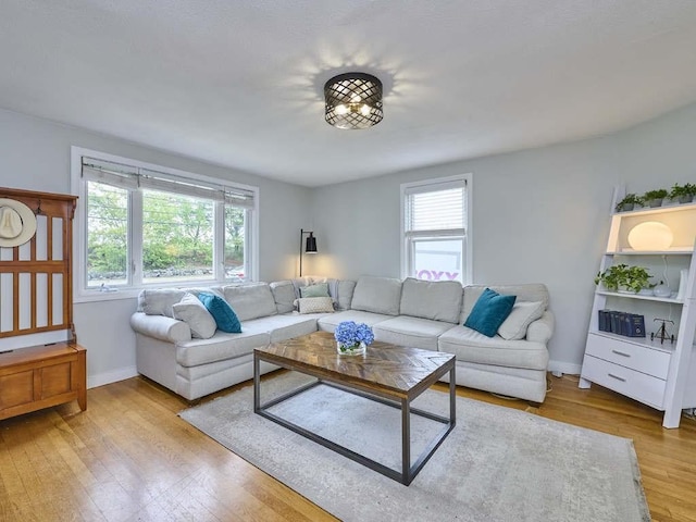 440 Forest St, Waltham, MA 02452 - living room featuring wood finished floors and baseboards