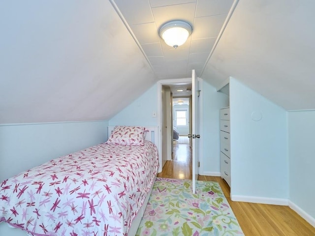 440 Forest St, Waltham, MA 02452 - bedroom featuring wood finished floors and vaulted ceiling