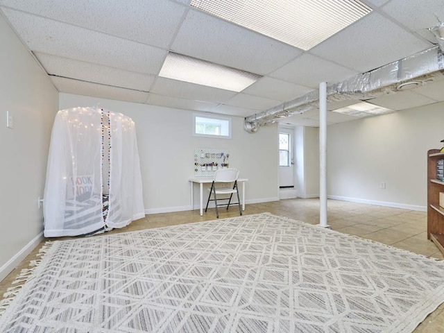 440 Forest St, Waltham, MA 02452 - basement with a drop ceiling, tile patterned flooring, and baseboards