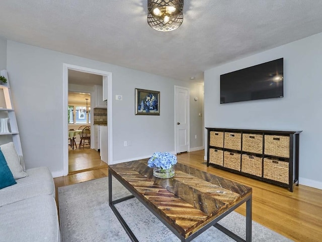 440 Forest St, Waltham, MA 02452 - living area featuring wood finished floors and baseboards