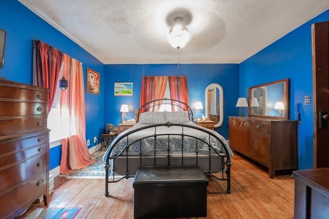1 Holly St, Attleboro, MA 02703 - bedroom featuring wood finished floors, a textured ceiling, and ceiling fan