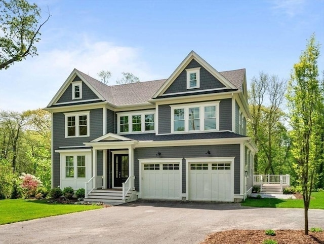 view of front of home with a garage and a front yard