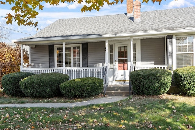 view of exterior entry featuring a porch