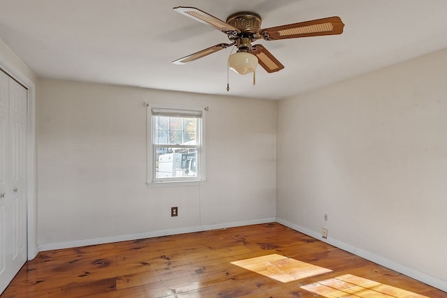 unfurnished room with ceiling fan and wood-type flooring