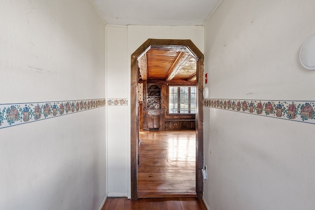 corridor with hardwood / wood-style flooring