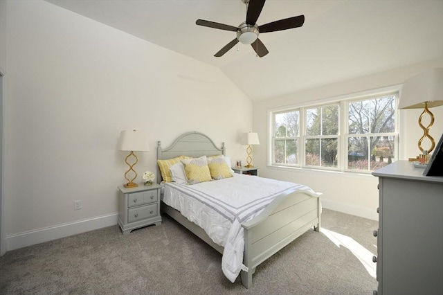 carpeted bedroom with ceiling fan and lofted ceiling