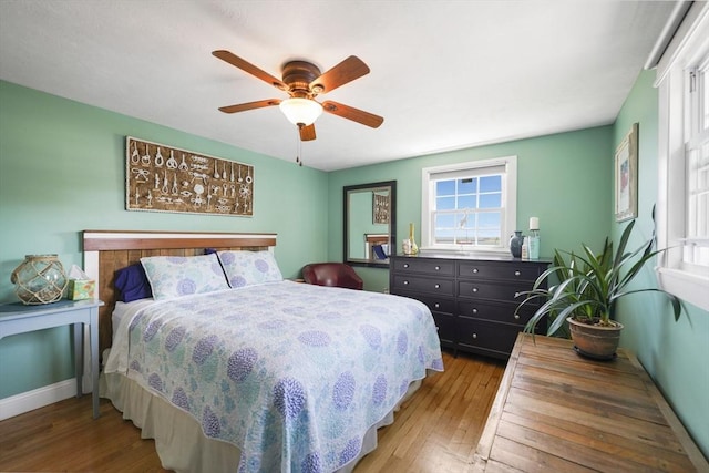 21 Hudson St, New Bedford, MA 02744 - bedroom featuring multiple windows, hardwood / wood-style floors, and baseboards