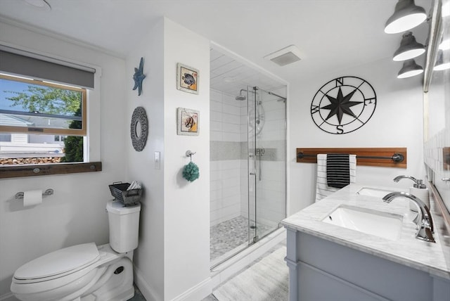 21 Hudson St, New Bedford, MA 02744 - full bath with toilet, a stall shower, double vanity, and baseboards