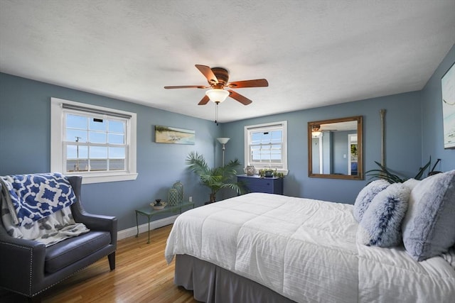 21 Hudson St, New Bedford, MA 02744 - bedroom featuring baseboards, wood finished floors, and a ceiling fan