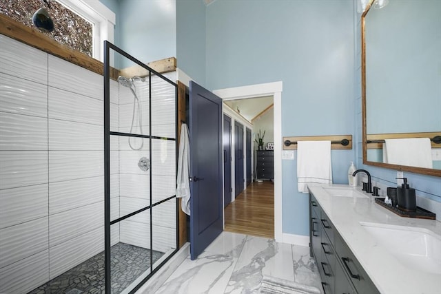 21 Hudson St, New Bedford, MA 02744 - bathroom featuring double vanity, a shower stall, marble finish floors, a towering ceiling, and baseboards