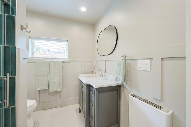 307 E Eagle St, Boston, MA 02128 - bathroom featuring vanity, radiator, a wainscoted wall, and recessed lighting