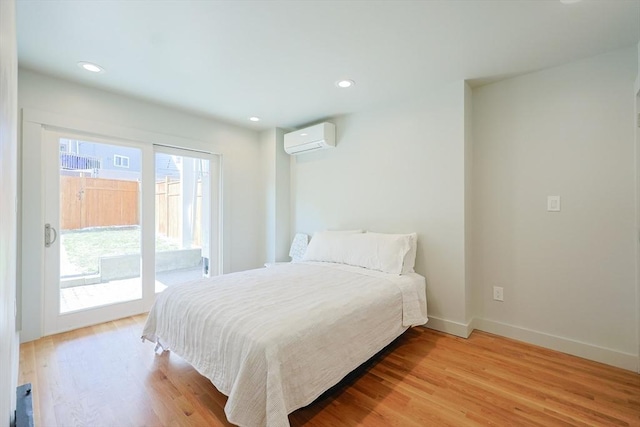 307 E Eagle St, Boston, MA 02128 - bedroom featuring a wall mounted AC, access to exterior, light wood-style flooring, and recessed lighting