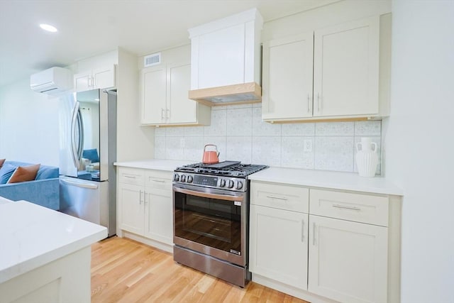 307 E Eagle St, Boston, MA 02128 - kitchen with stainless steel appliances, premium range hood, light wood-type flooring, backsplash, and light countertops