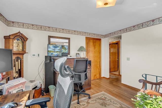 office space with light hardwood / wood-style floors