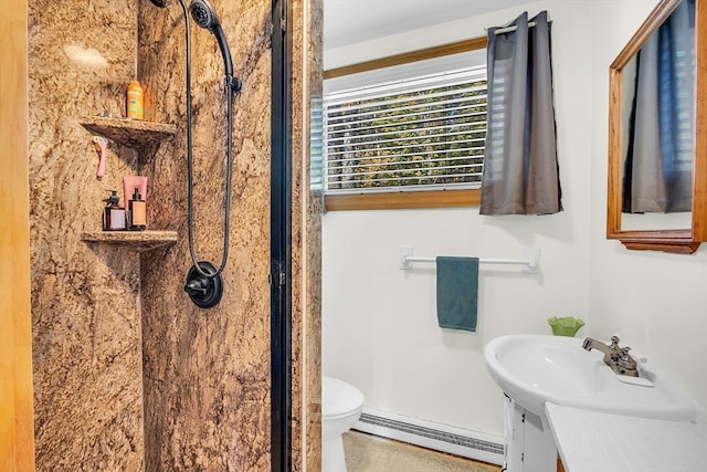 bathroom with vanity, a baseboard radiator, and toilet