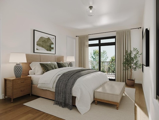 33 Pearl St Unit 6, Boston, MA 02125 - bedroom with wood finished floors, baseboards, and access to exterior