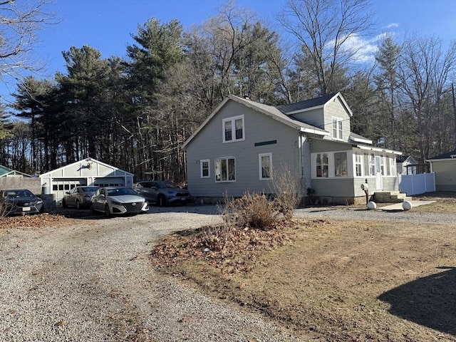 view of home's exterior with an outbuilding and a garage