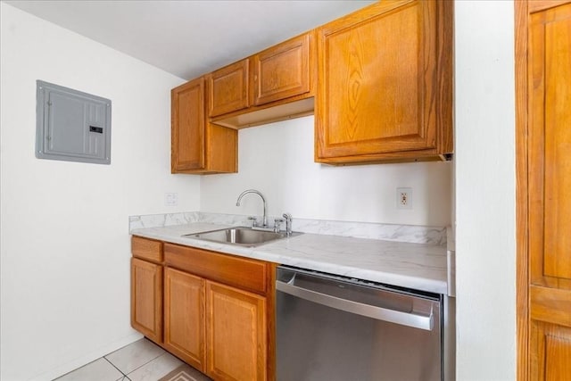 kitchen featuring electric panel, a sink, light countertops, light tile patterned floors, and stainless steel dishwasher
