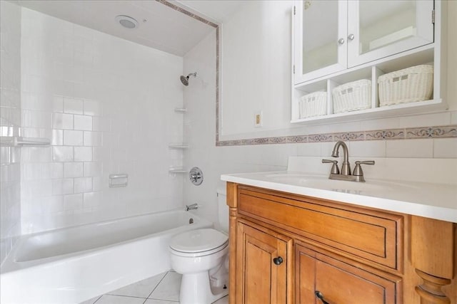 full bath featuring toilet, tile walls, vanity, tile patterned flooring, and shower / bath combination