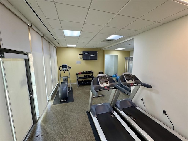 workout room featuring a paneled ceiling