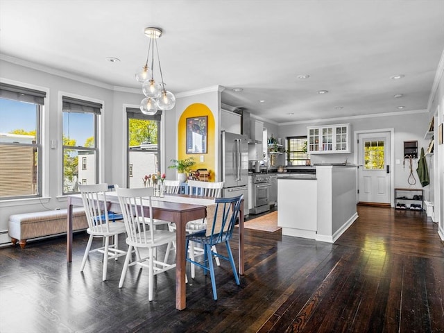 dining room featuring plenty of natural light, dark wood-type flooring, recessed lighting, and ornamental molding