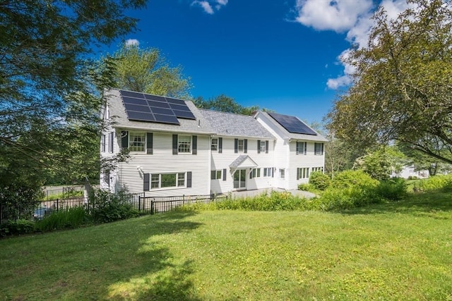 26 N Hillside Rd, Deerfield, MA 01373 - back of property featuring solar panels and a chimney