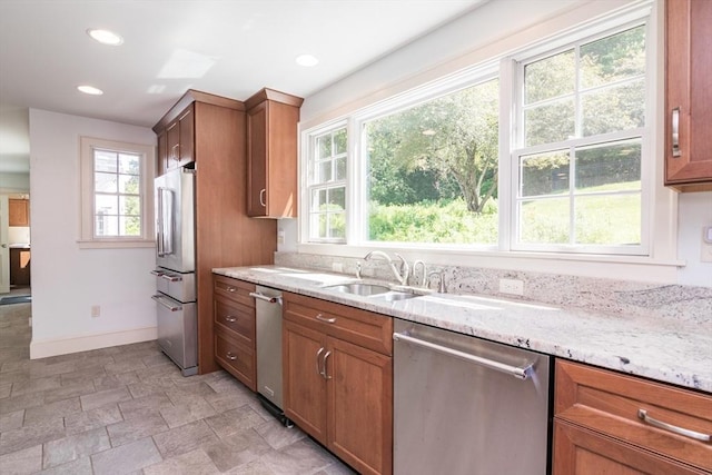 26 N Hillside Rd, Deerfield, MA 01373 - kitchen with stainless steel appliances, light stone counters, brown cabinets, recessed lighting, and stone finish flooring