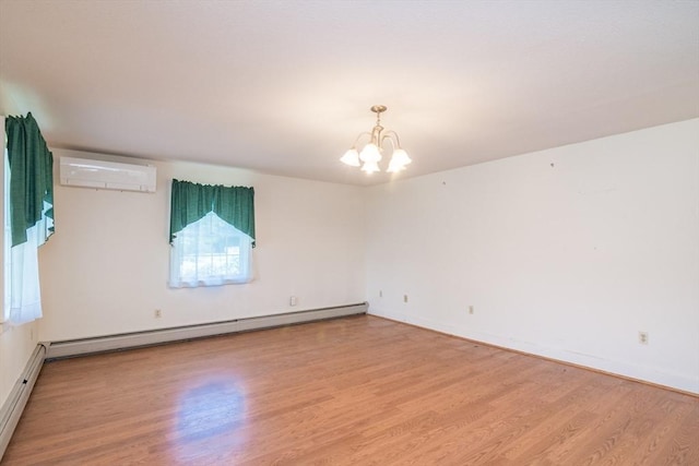 26 N Hillside Rd, Deerfield, MA 01373 - unfurnished room with baseboard heating, an AC wall unit, wood finished floors, a chandelier, and a baseboard radiator