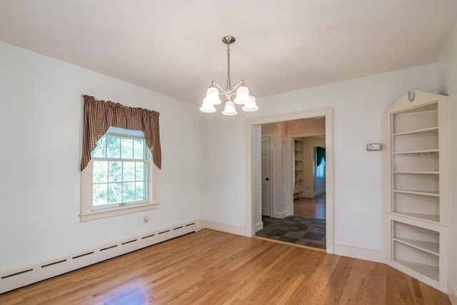 26 N Hillside Rd, Deerfield, MA 01373 - unfurnished room with a baseboard heating unit, a chandelier, and light wood-type flooring
