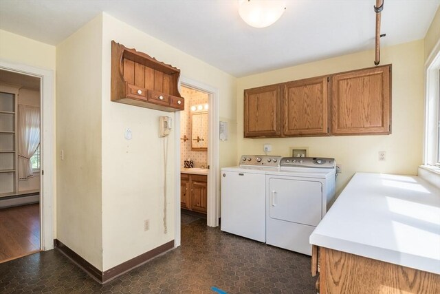 26 N Hillside Rd, Deerfield, MA 01373 - washroom featuring cabinet space, independent washer and dryer, dark flooring, and baseboard heating