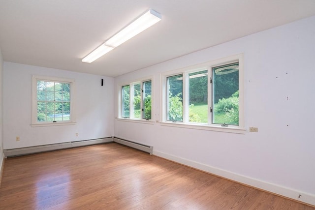 26 N Hillside Rd, Deerfield, MA 01373 - spare room with light wood finished floors and a baseboard radiator