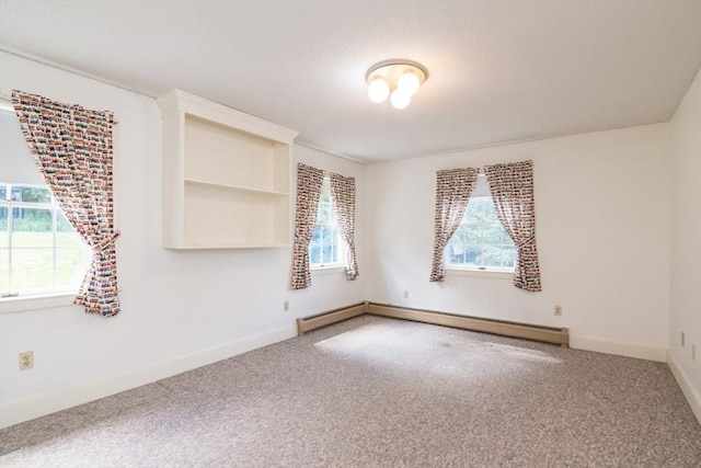26 N Hillside Rd, Deerfield, MA 01373 - spare room featuring carpet floors and a baseboard heating unit