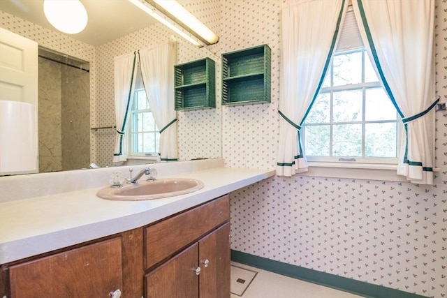 26 N Hillside Rd, Deerfield, MA 01373 - bathroom with healthy amount of natural light, vanity, and wallpapered walls