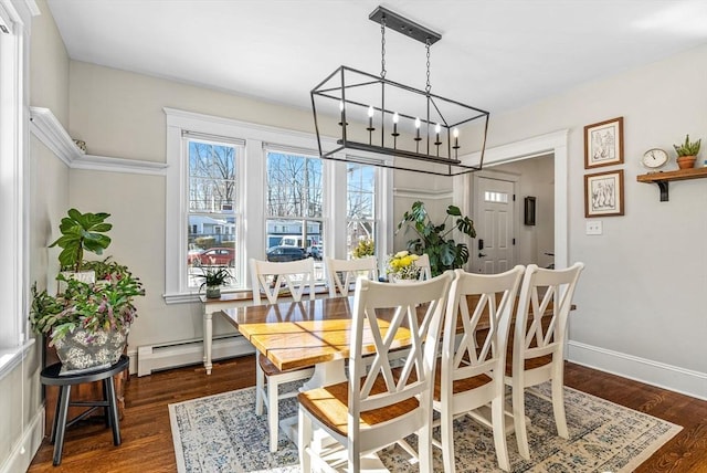 dining area with dark wood-style flooring, baseboards, baseboard heating, and an inviting chandelier