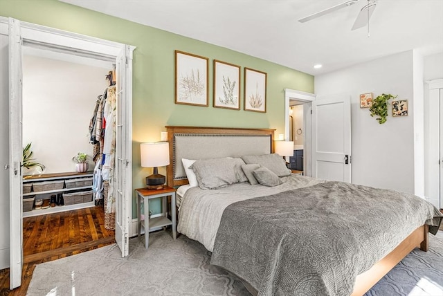 bedroom featuring ceiling fan and wood finished floors