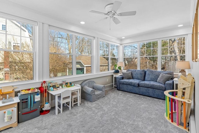 sunroom / solarium with ceiling fan