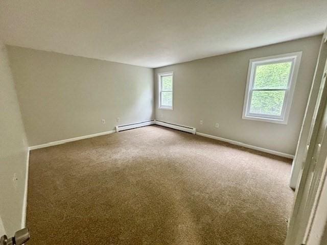 139 E County Rd Unit 139, Rutland, MA 01543 - spare room with carpet, baseboards, and a baseboard heating unit