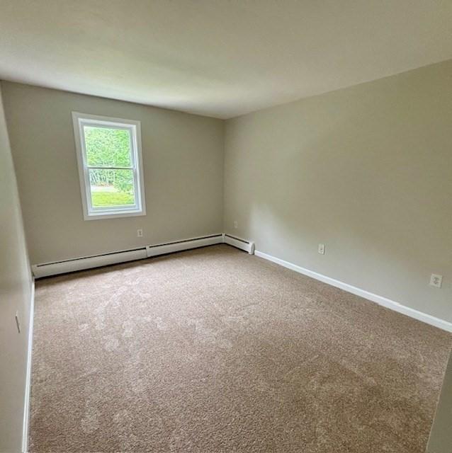 139 E County Rd Unit 139, Rutland, MA 01543 - carpeted spare room featuring baseboard heating and baseboards